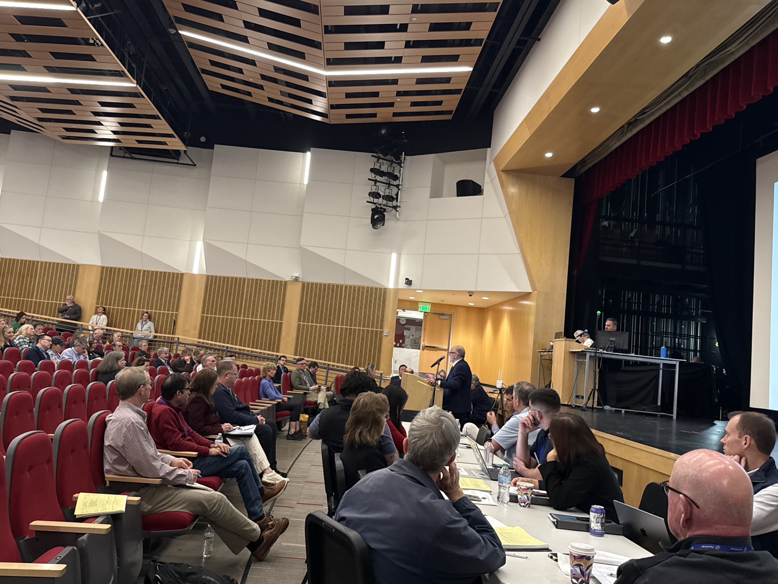 Superintendent Frank Hackett answers questions on Article 29 from the auditorium podium