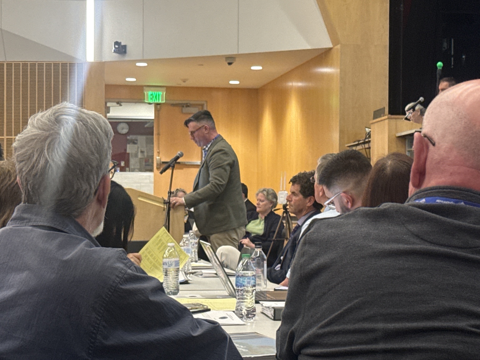 School Committee Chair Tim Matthews speaks to Town Meeting on Article 29
