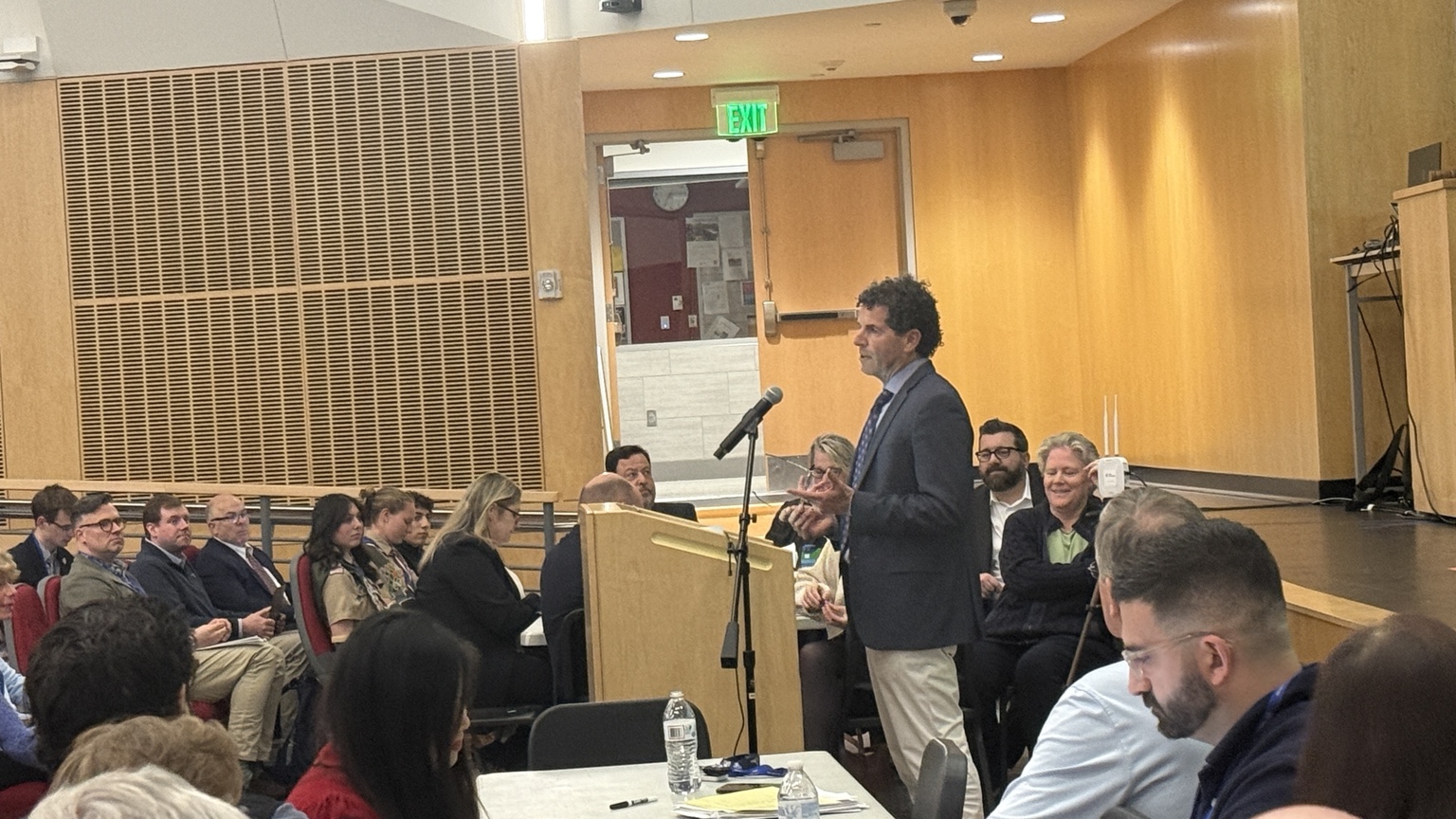 Finance Committee Chair Derek Ross presenting the FY27 budget to Town Meeting